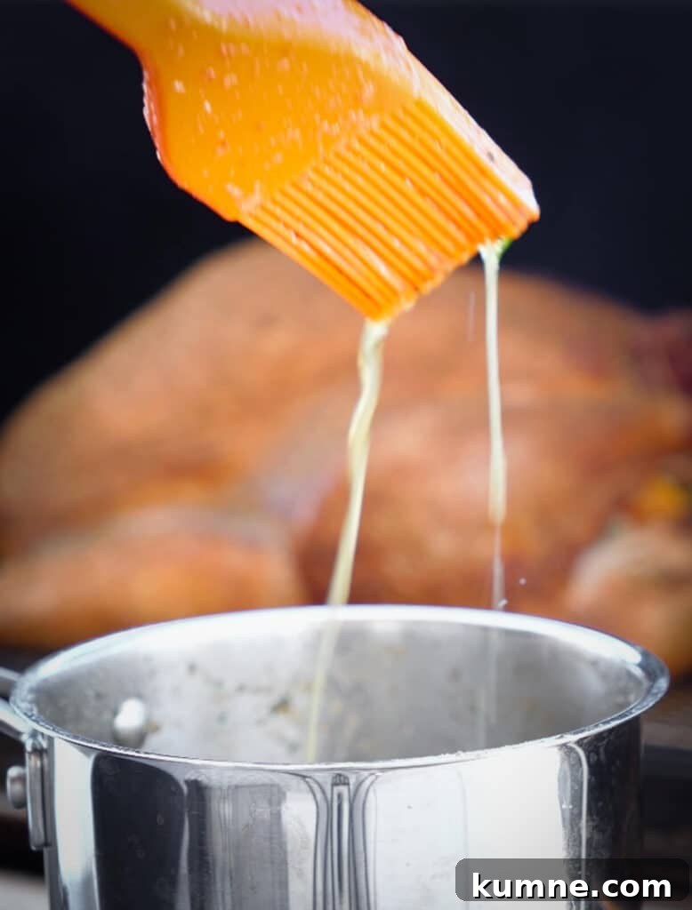 melted butter dripping off of a basting brush