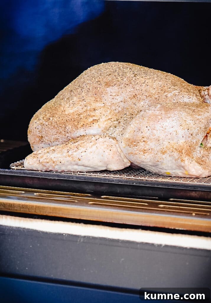 uncooked turkey inside of a smoker