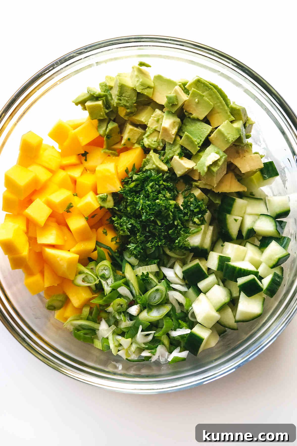 Cucumber, Mango & Avocado Salad with Lime Dressing 4 Cube and chop all ingredients and add to a large bowl.