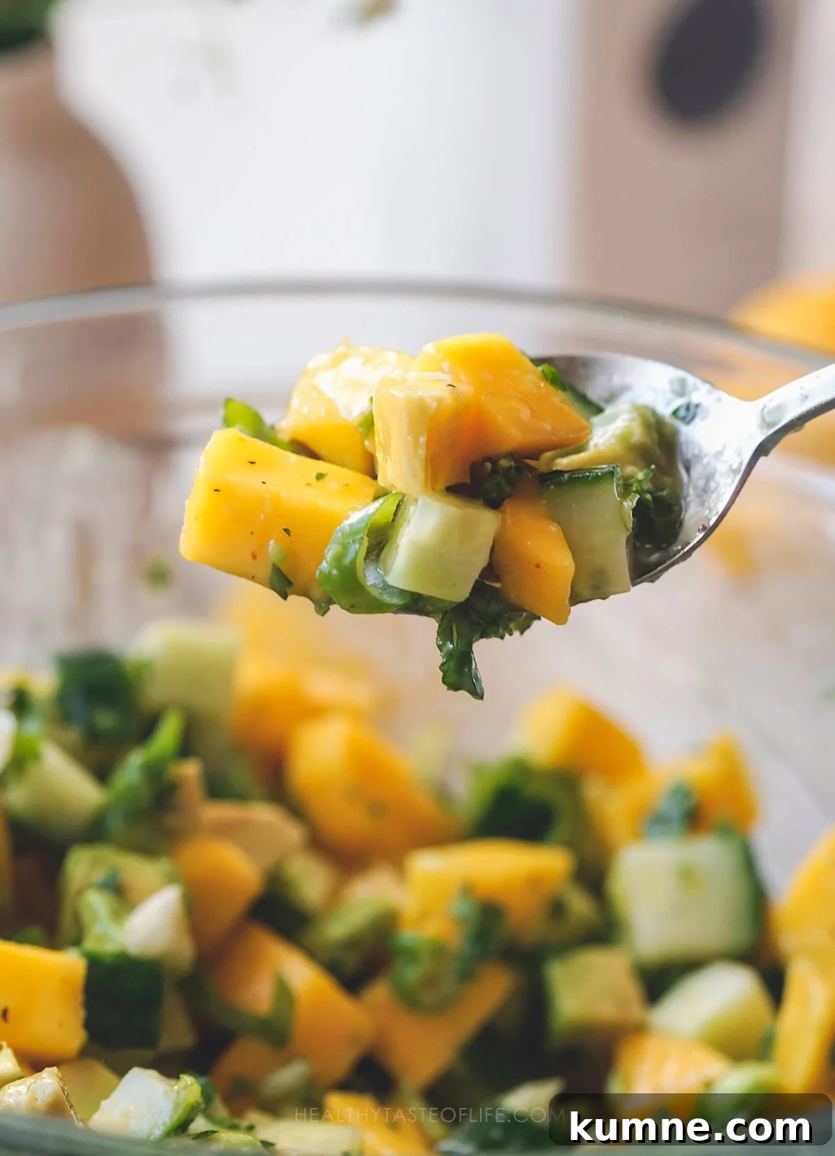 Cucumber, Mango & Avocado Salad with Lime Dressing 7 Spoonful of cucumber mango salad with avocado.