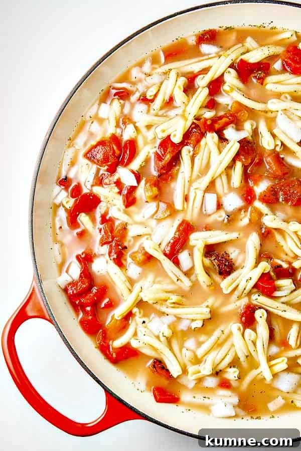 One Pot Pasta with Roasted Red Peppers, and a creamy Goat Cheese sauce! Just toss your ingredients into the pot with your UNCOOKED pasta and go!