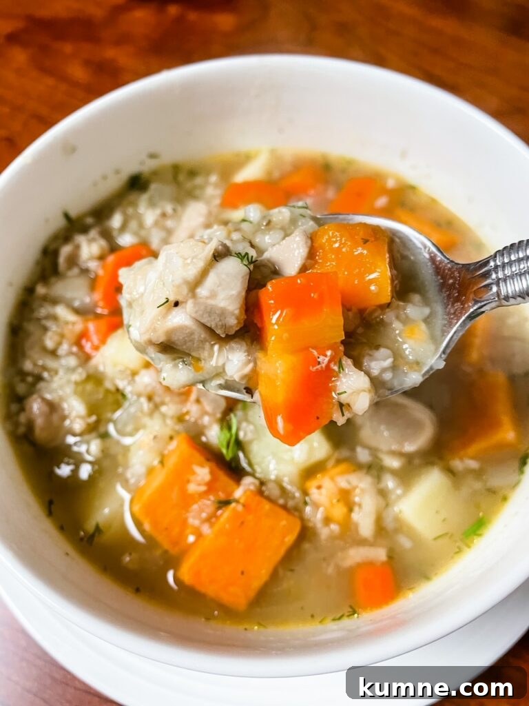 5 Essential Hosting Tips to Impress Your Guests 8 A bowl of Buckwheat Chicken Soup with Sweet Potato with a spoon
