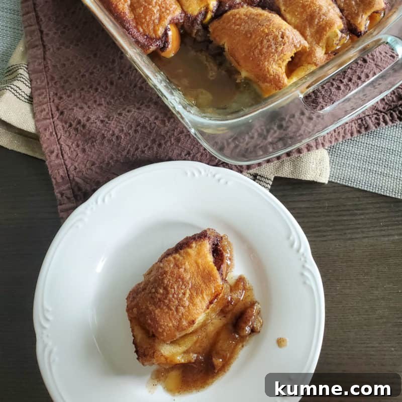 Top Fall Dessert Recipes You Need to Try This Season 11 Apple Pie Dumpling on a white plate next to a glass baking dish