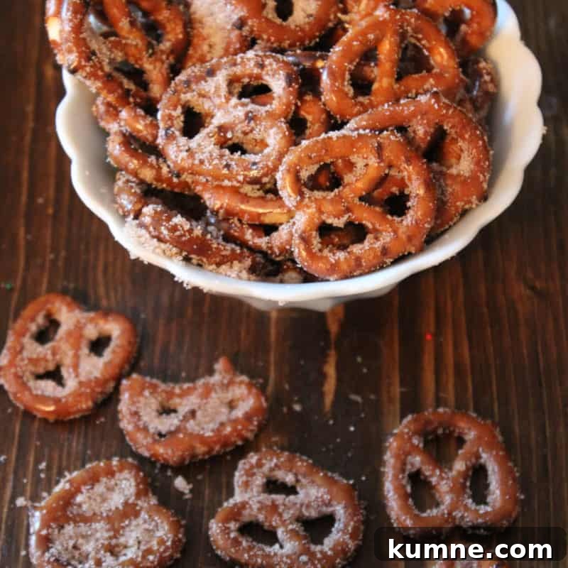 Top Fall Dessert Recipes You Need to Try This Season 26 Cinnamon Sugar Pretzels in a white bowl and spread on a wood board