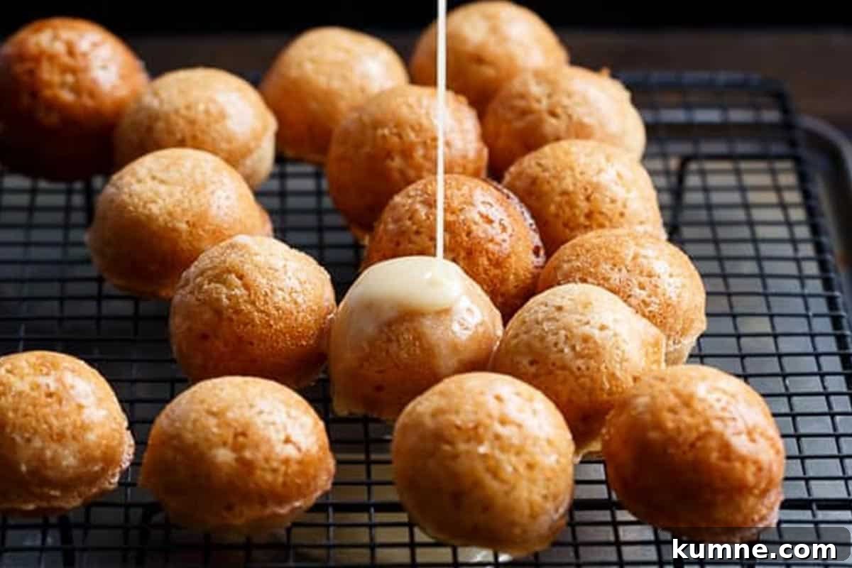 Maple-Glazed Apple Fritter Donut Holes Recipe 11 Close-up shot of Maple Glazed Apple Fritter Donut Holes.