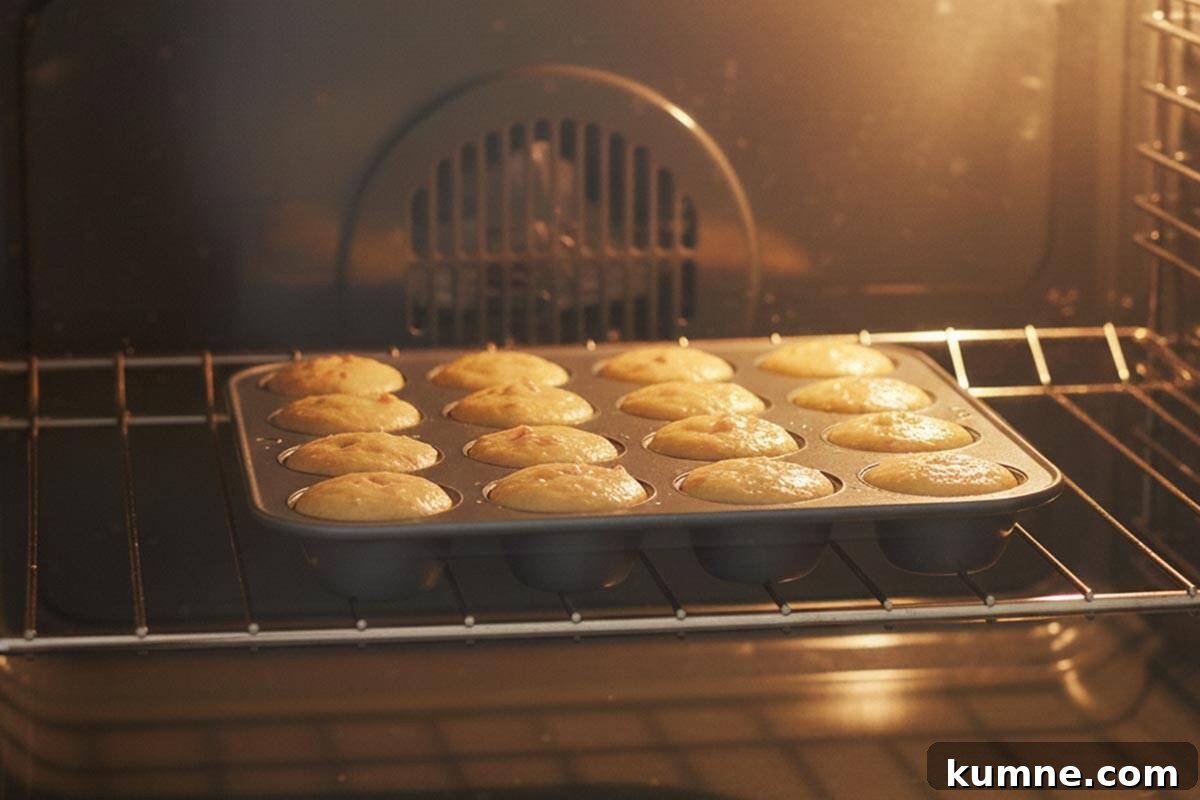 Maple-Glazed Apple Fritter Donut Holes Recipe 9 Baking the donut holes in the oven.