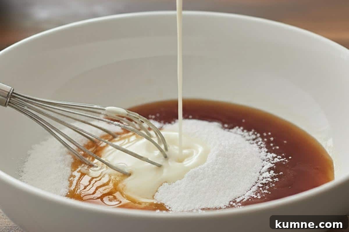 Maple-Glazed Apple Fritter Donut Holes Recipe 10 Mixing powdered sugar, maple syrup, and milk in a bowl.