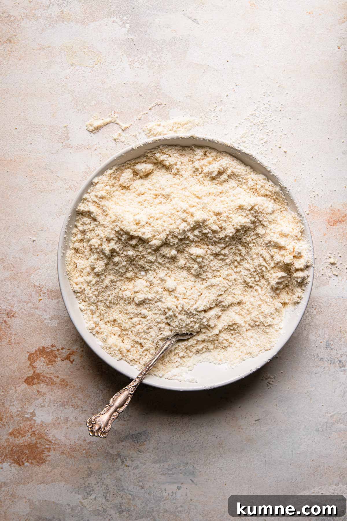 Light and Tender Passover Cake Recipe for a Perfect Seder 3 A bowl with almond flour and a fork.