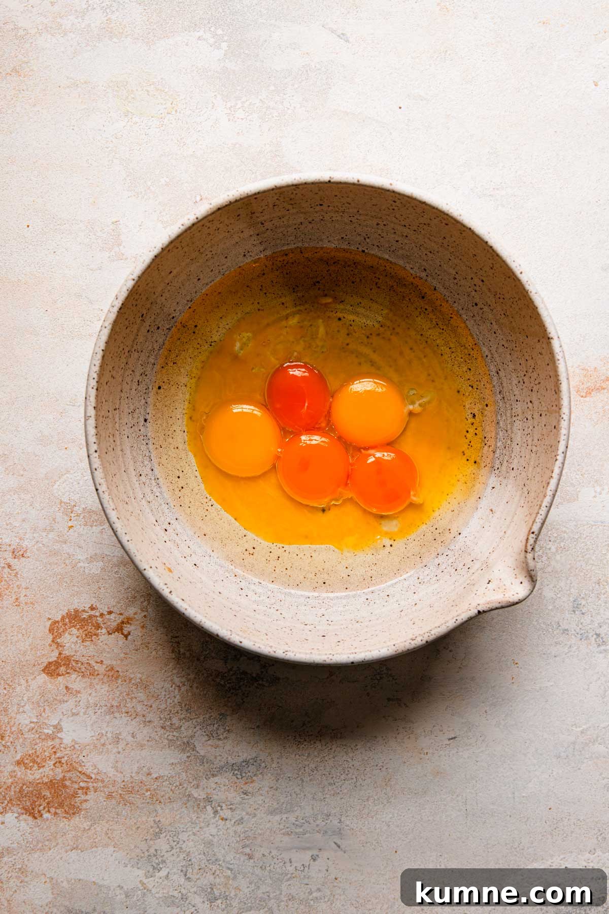 Light and Tender Passover Cake Recipe for a Perfect Seder 4 A large bowl with egg yolks and oil.