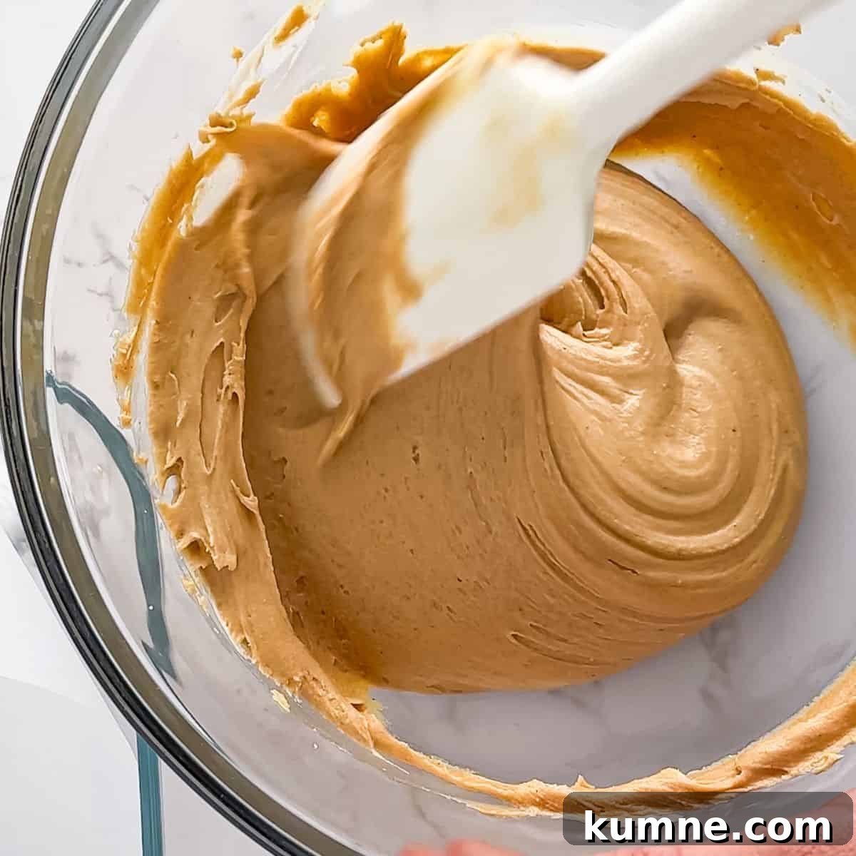 Creamy 2-Ingredient Peanut Butter Fudge Recipe 6 Mixing the ingredients together.
