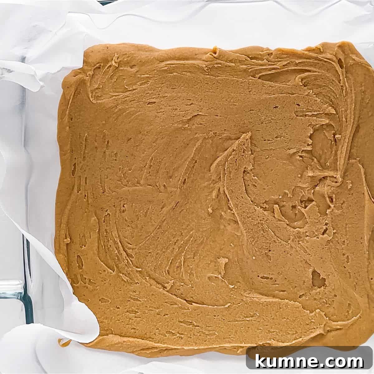 Creamy 2-Ingredient Peanut Butter Fudge Recipe 7 Spreading the 2-Ingredient Peanut Butter Fudge in a prepared pan.