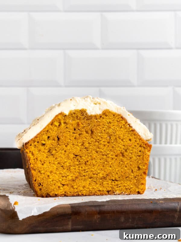 Homemade Pumpkin Spice Donuts Recipe for Fall Baking 6 A loaf of pumpkin bread with frosting