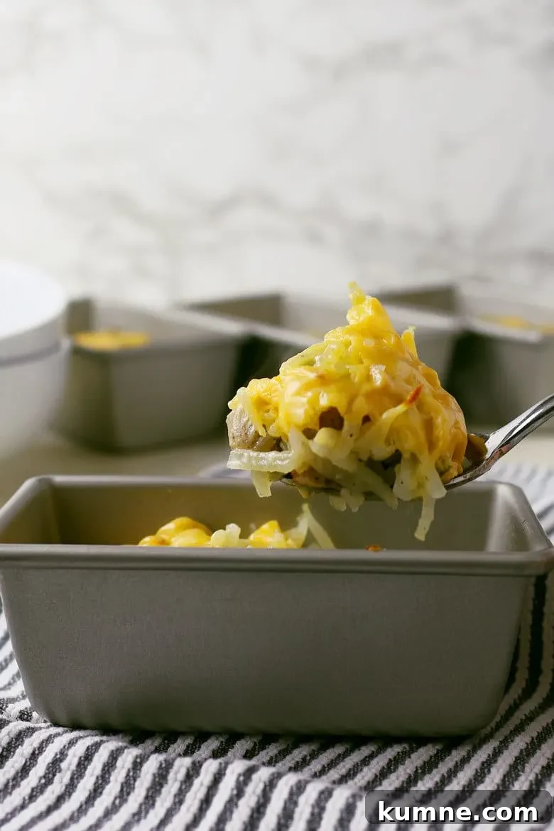 Finished individual sausage hashbrown breakfast casseroles ready to serve.