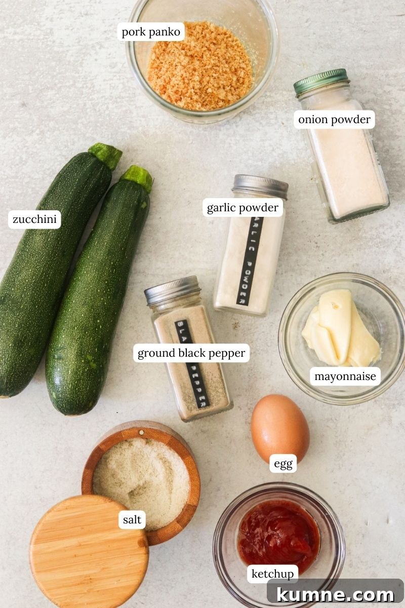 Keto Air Fryer Zucchini Fries Recipe for Low-Carb Snacks 3 recipe ingredients in small bowls and labeled.