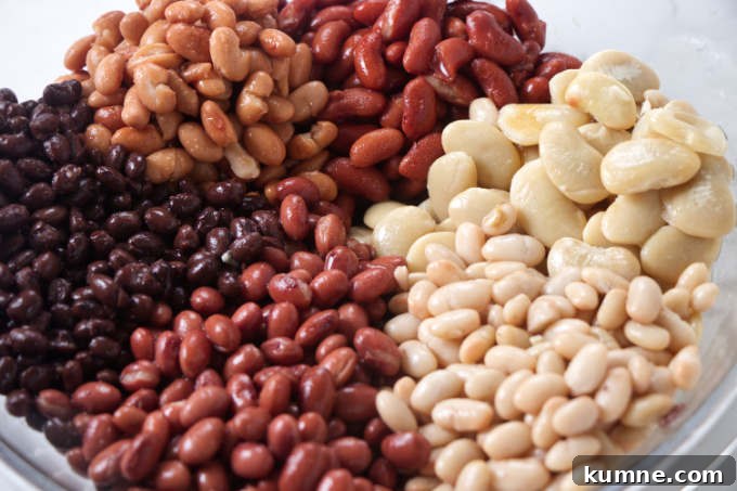 Smoky Cowboy Baked Beans Recipe with Bacon and Brown Sugar 3 Six different bean varieties that are in cowboy baked beans.
