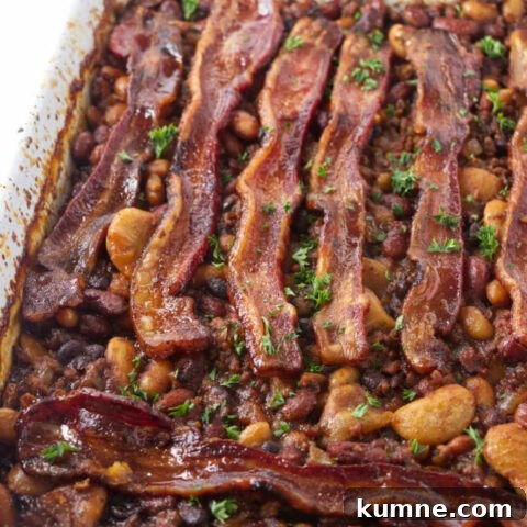 Cowboy baked beans fresh out of the oven with bacon on top.