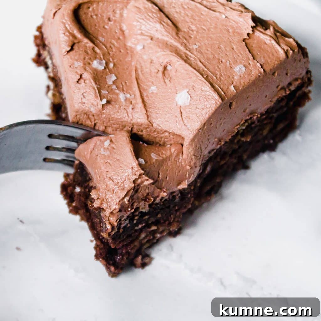 close up of a slice of mini chocolate cake being cut with a fork