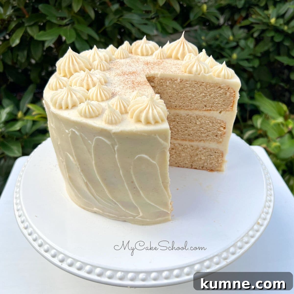 Ultimate Cinnamon Cake Recipe for Moist, Spiced Perfection 6 Cinnamon Cake, sliced, on pedestal.