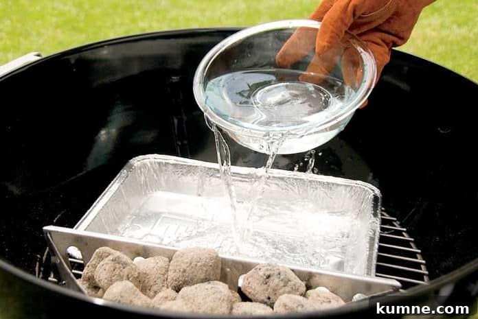 Minion Method: Slow Low-Temperature Cooking Guide for Perfect Smokes 4 pouring water into grill water pan