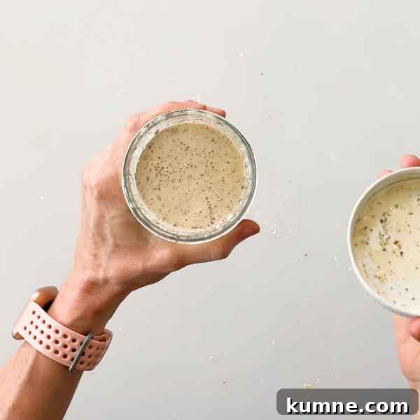 Olive Garden Creamy Italian Dressing Copycat Recipe — Quick Guide 7 Shaking dressing ingredients in a jar.