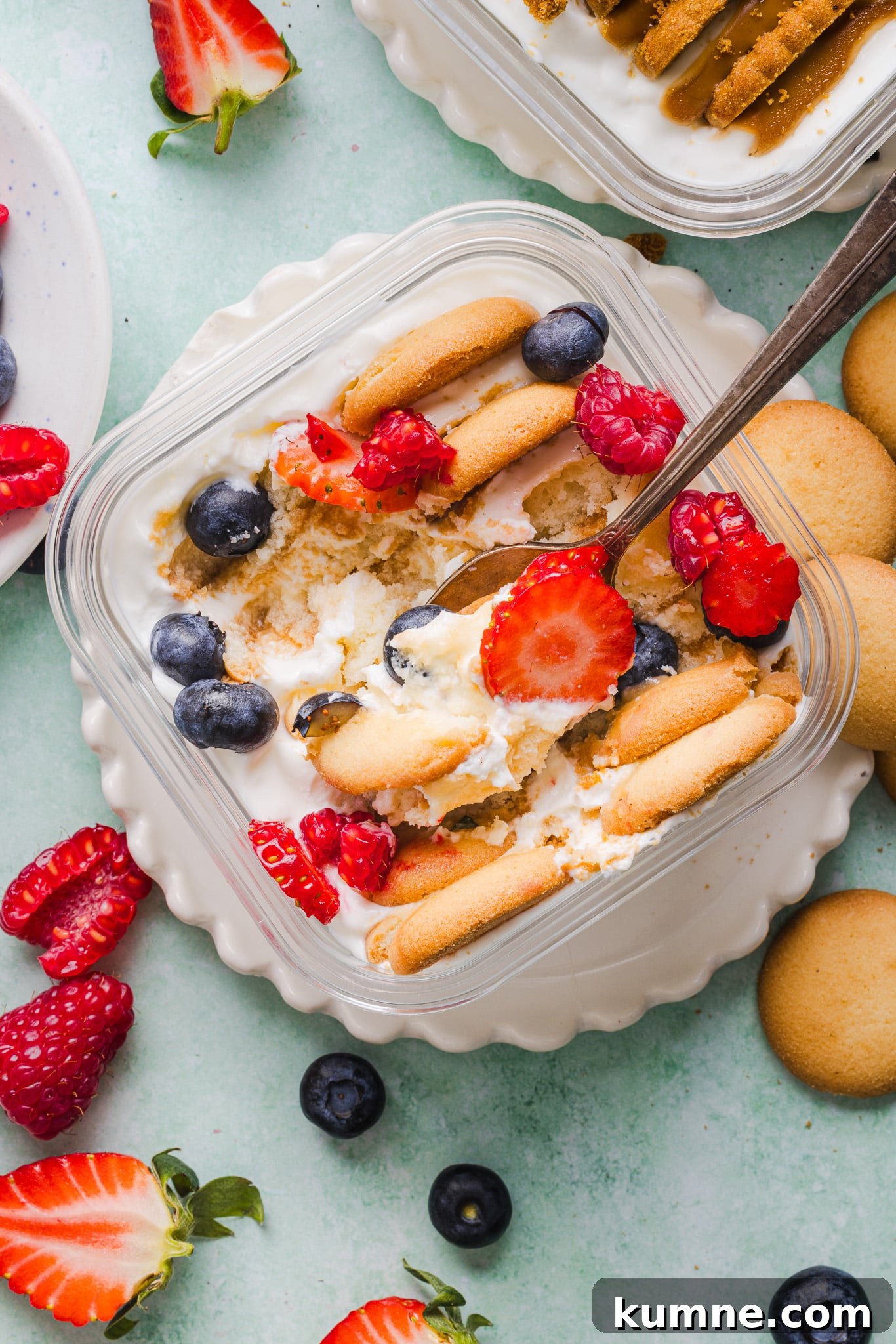 Cookies and berries in Greek yogurt to make Greek yogurt cheesecake.