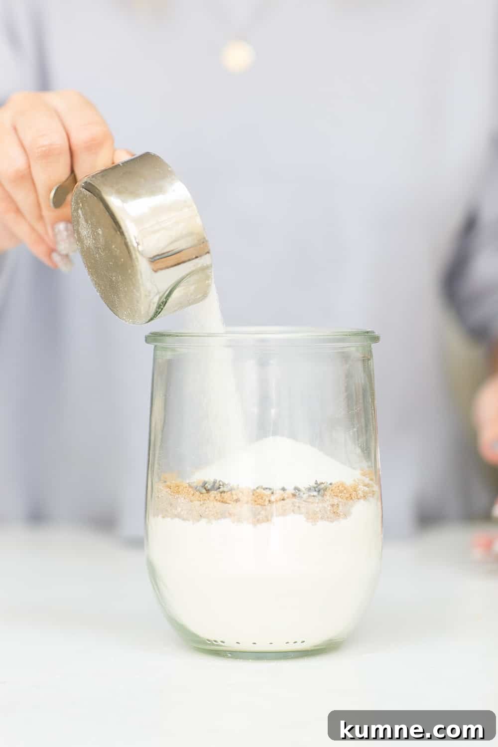 pouring ingredients into a jar