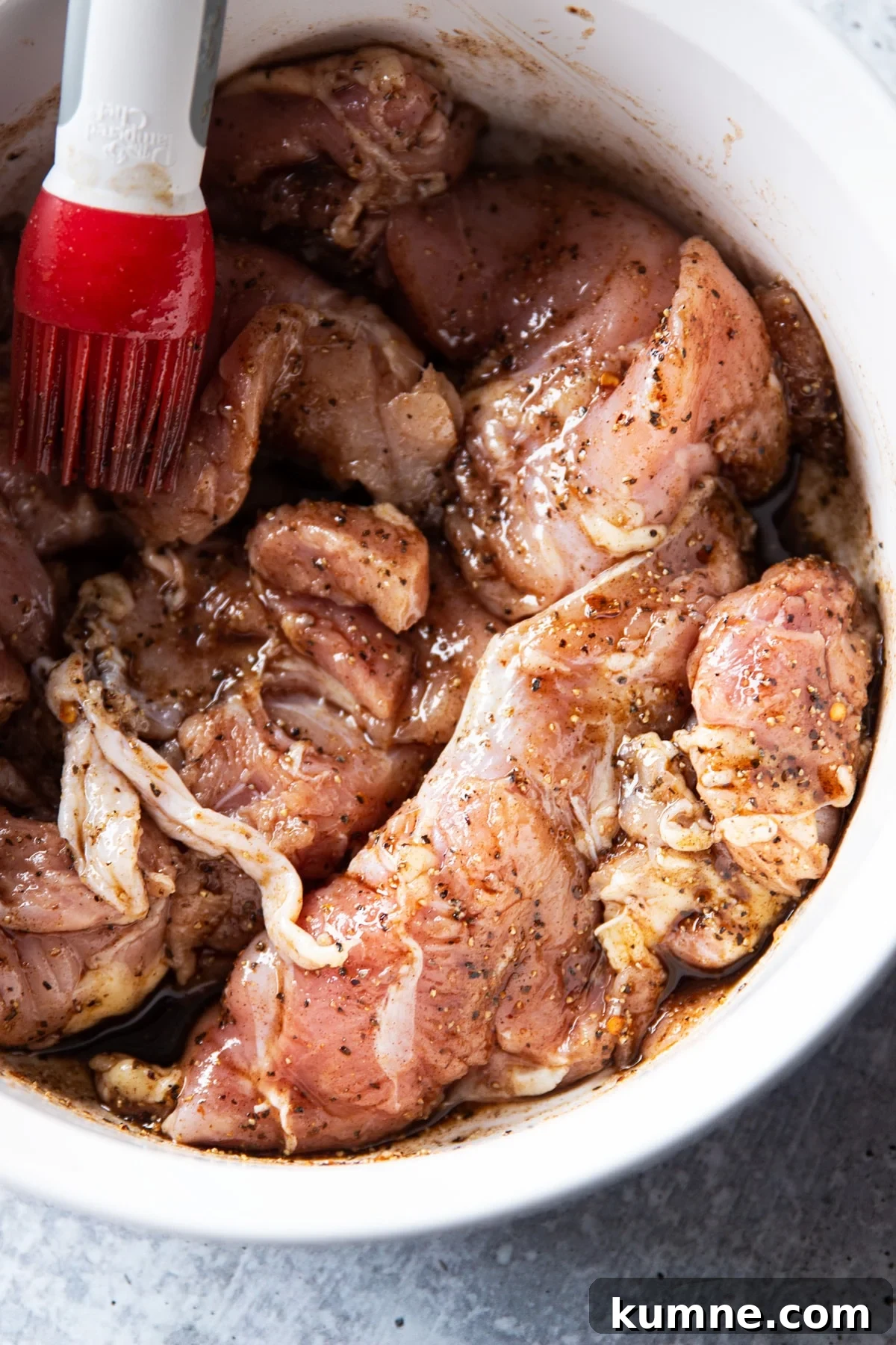 Authentic Asian Chicken Noodle Soup Recipe for Comforting Flavor 7 Bowl of marinated chicken thighs in asian marinade.
