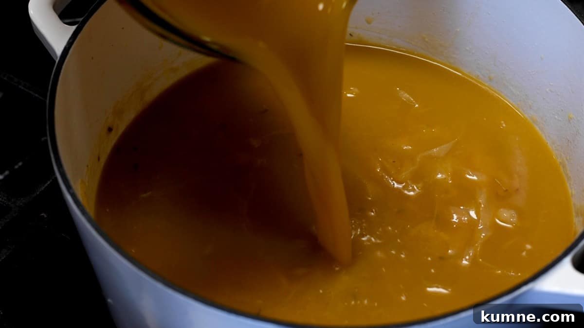 adding vegetable broth