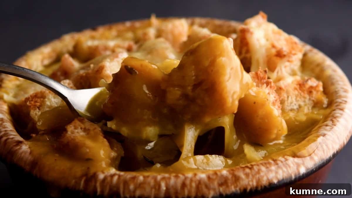 taking a bite of hot vegetarian french onion soup