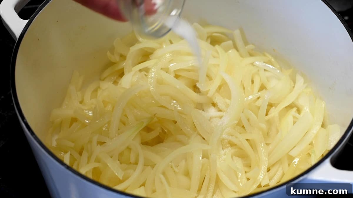 adding sugar to onions