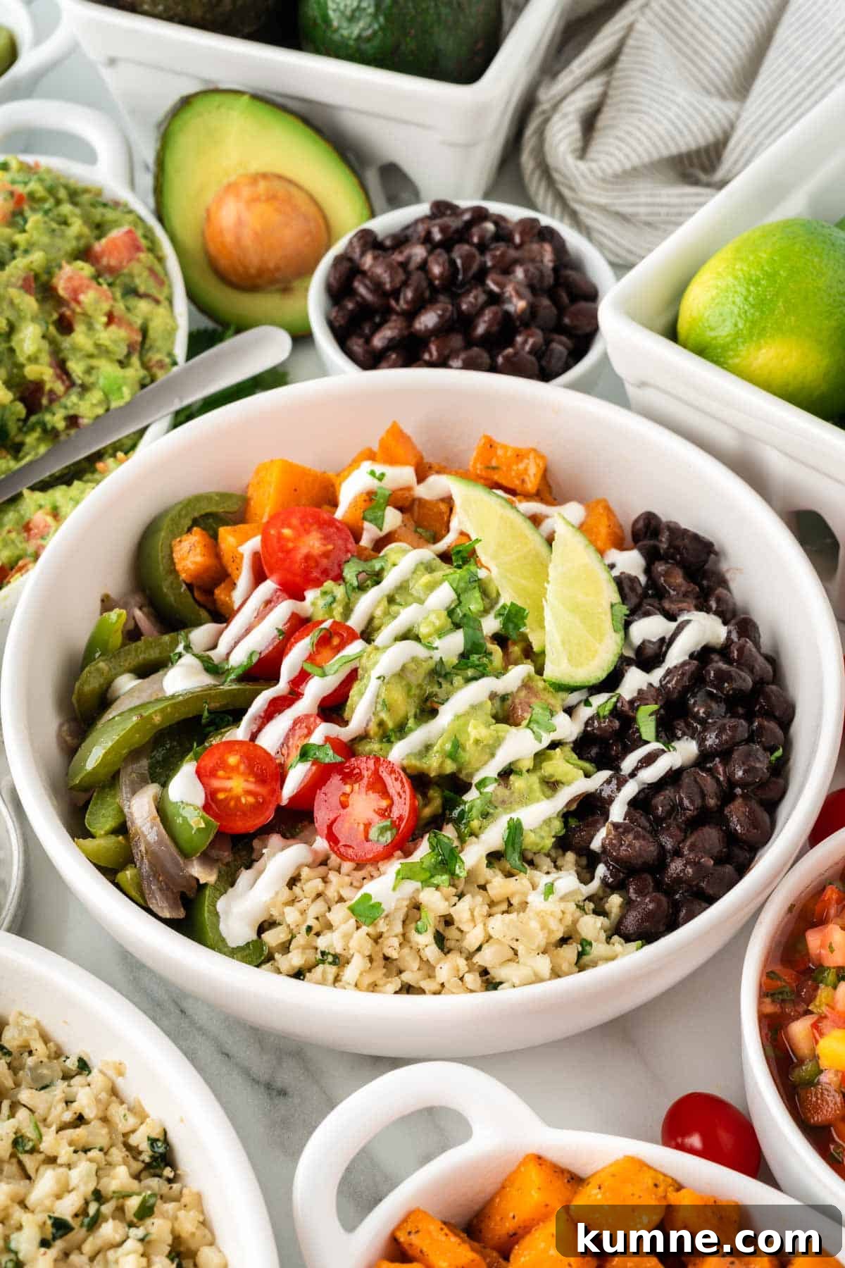 Cilantro Lime Cauliflower Rice Recipe — Zesty Low-Carb Side 11 cauliflower rice burrito bowl with black beans, fajita veggies, sweet potatoes, and guacamole