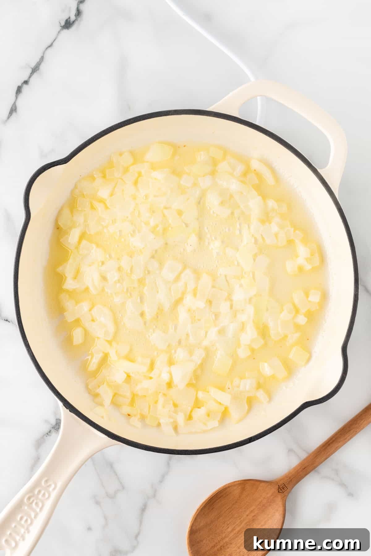 Cilantro Lime Cauliflower Rice Recipe — Zesty Low-Carb Side 7 adding garlic and onion to the skillet