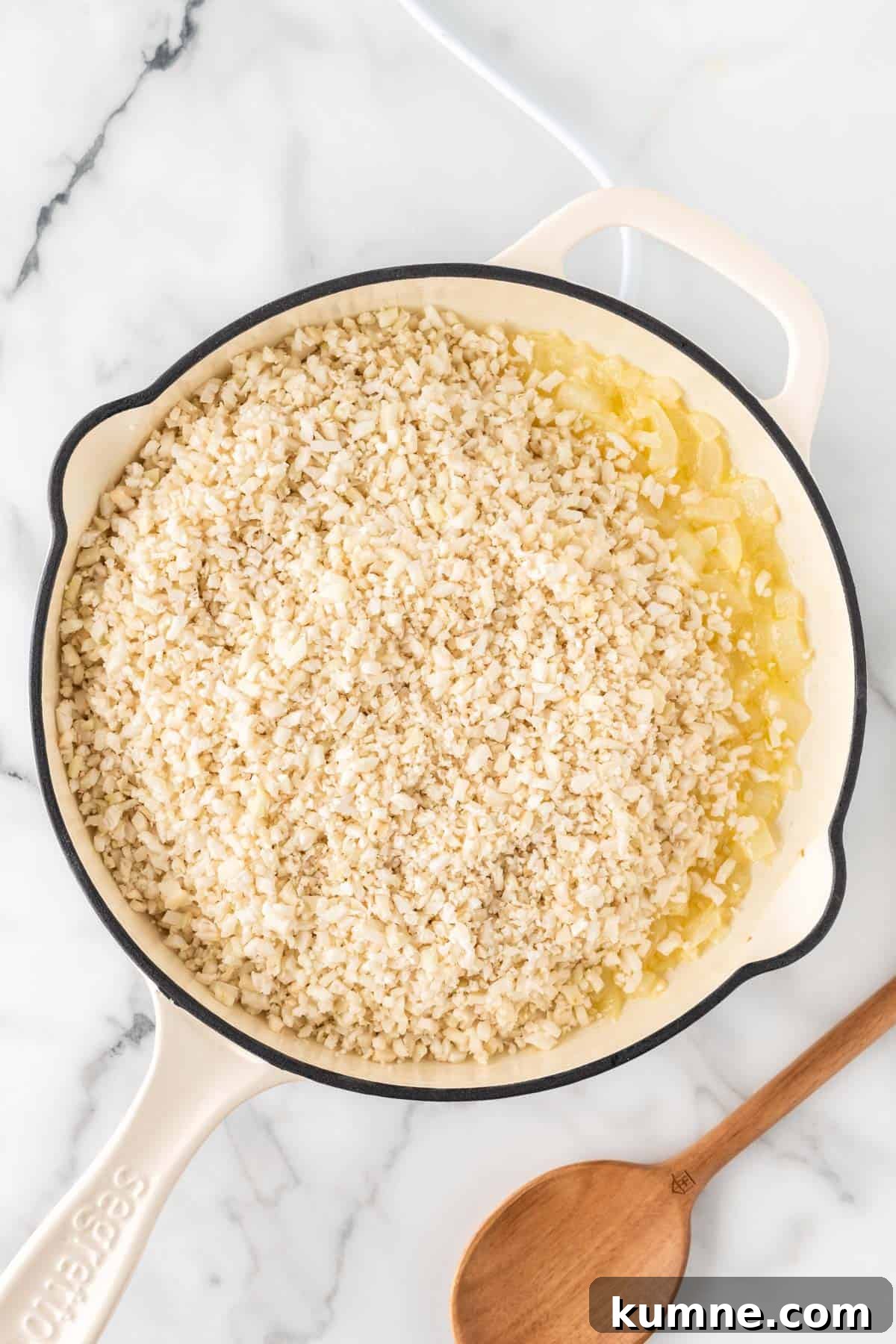 Cilantro Lime Cauliflower Rice Recipe — Zesty Low-Carb Side 8 adding the cauliflower rice