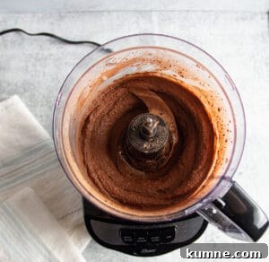 Picture of a food processor with hummus blended.