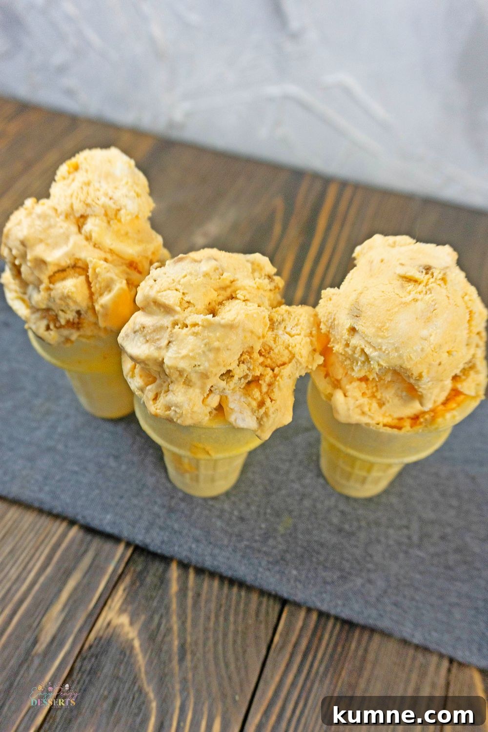 No-Churn Pumpkin Ice Cream with Gingersnap Cookies 4 Image of pumpkin and gingersnap ice cream in ice cream cones