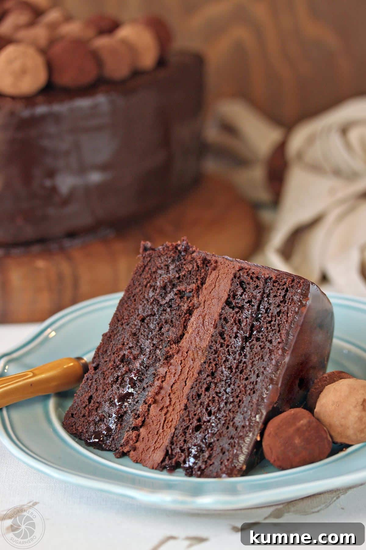 Truffle-Topped Heart Cake - A single slice of the cake with a chocolate filling and truffles on top.