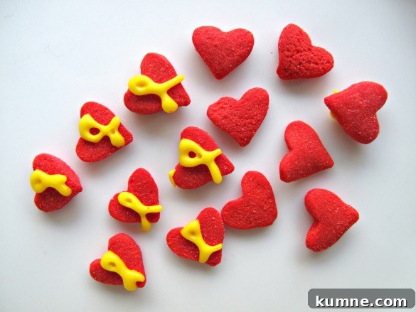 Valentine Sugar Cookies for Care Packages: Military Edition #9 6 Red heart sprinkles each with a yellow "support our troops" ribbons piped on top.