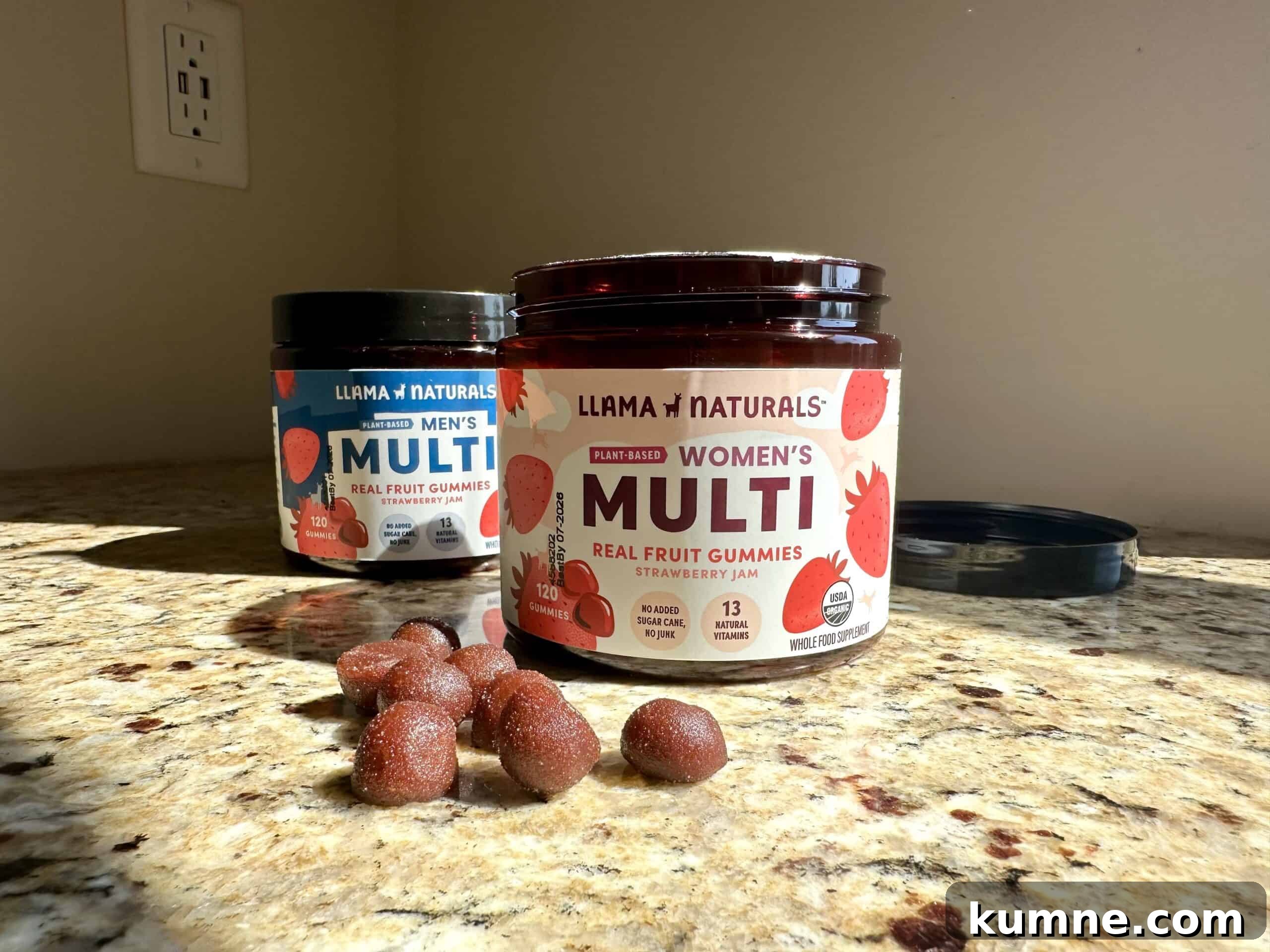Organic Kids Vitamins: Top Picks Without Artificial Additives 5 Two containers of Llama Naturals multivitamin gummies, labeled “Men’s Multi” and “Women’s Multi,” sit on a granite counter with several red, sugar-dusted gummies scattered in front.