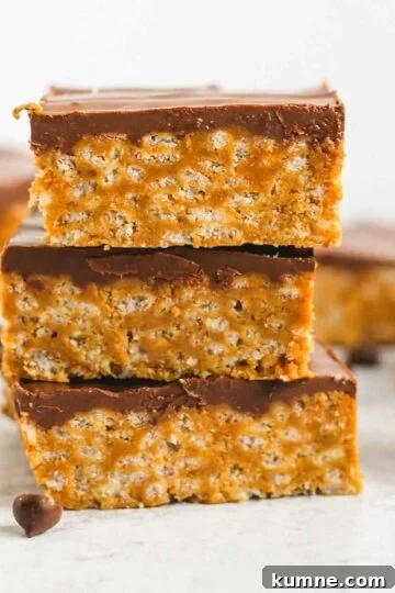 Healthier scotcheroo bars stacked 3 high.