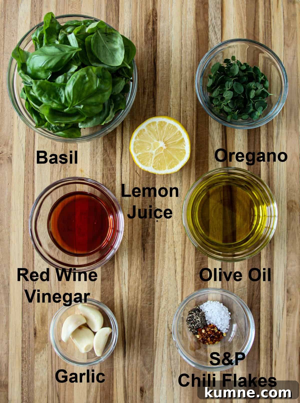 The ingredients for this recipe in glass bowls on a wooden board.