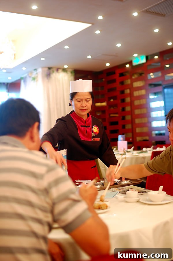 lady serving yum cha Hong Kong