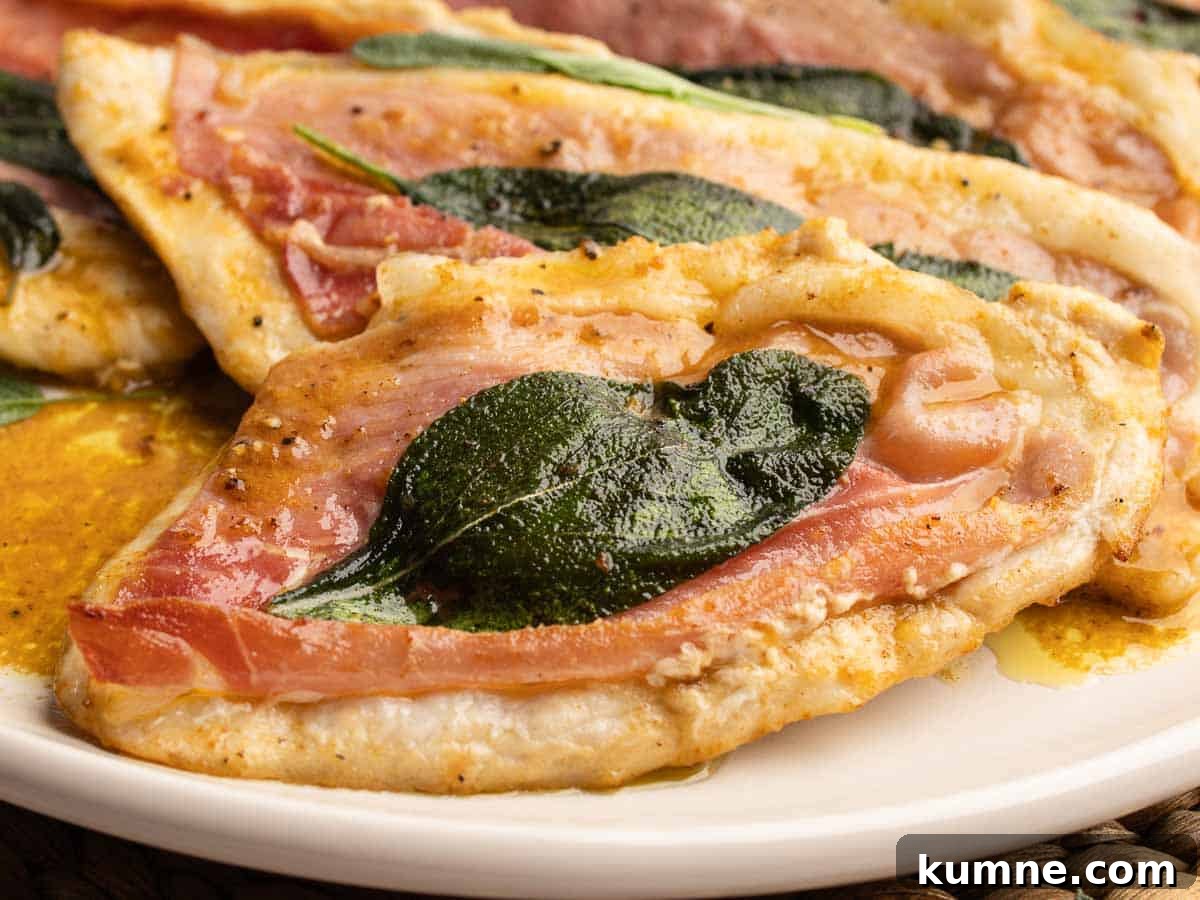 Close up of chicken cutlets topped with prosciutto and sage leaves.