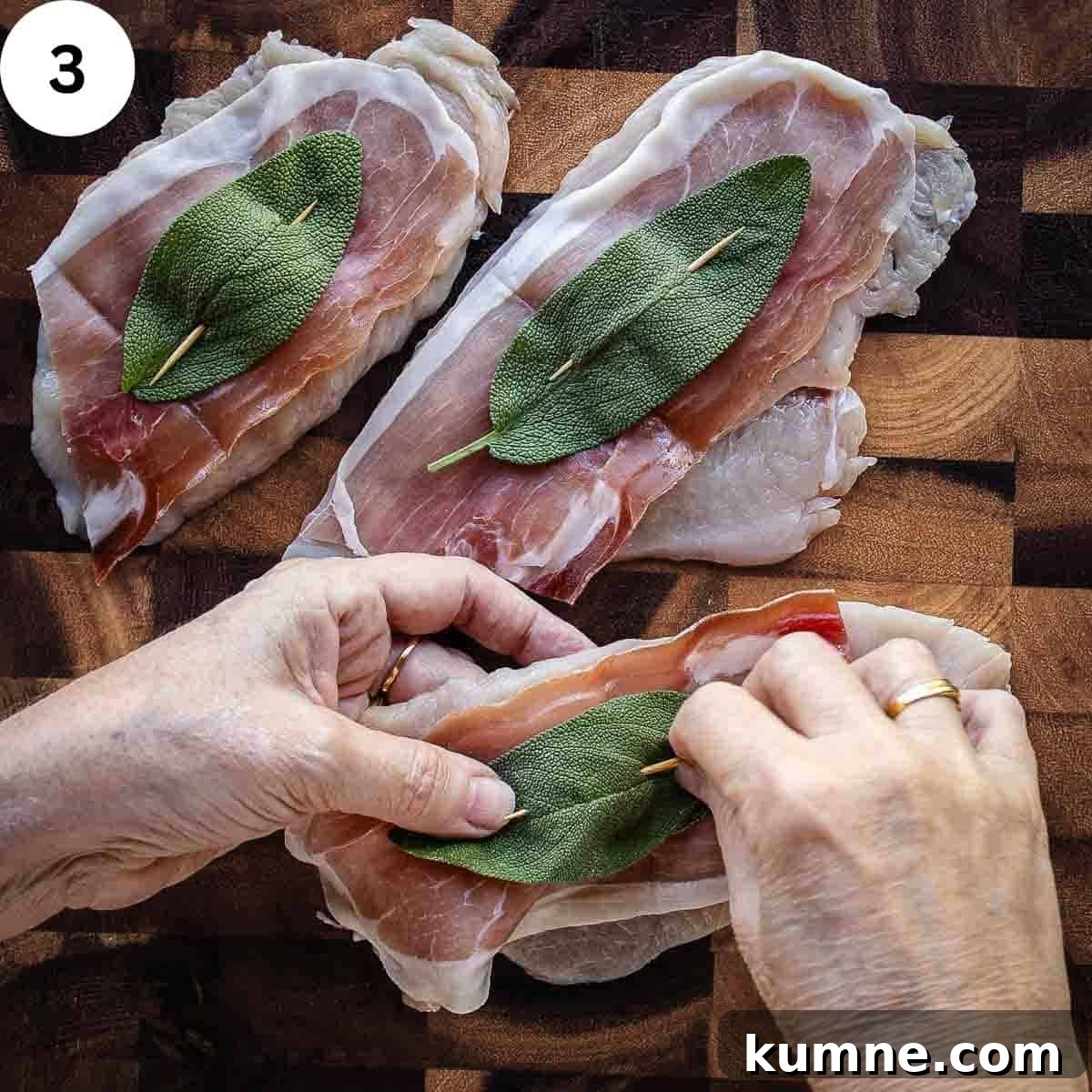 Skewering prosciutto and a sage leaf onto a chicken cutlet with a toothpick.