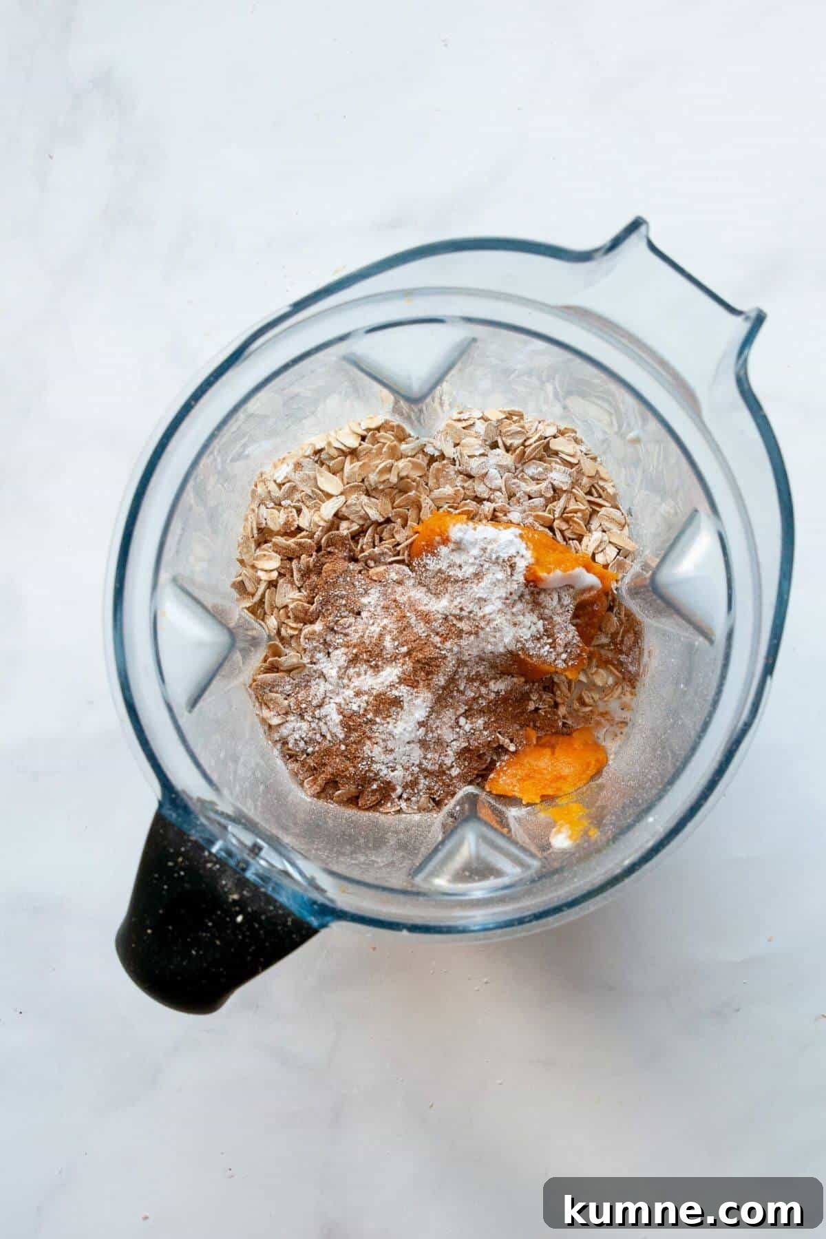All pumpkin protein pancake ingredients added into a blender before blending.