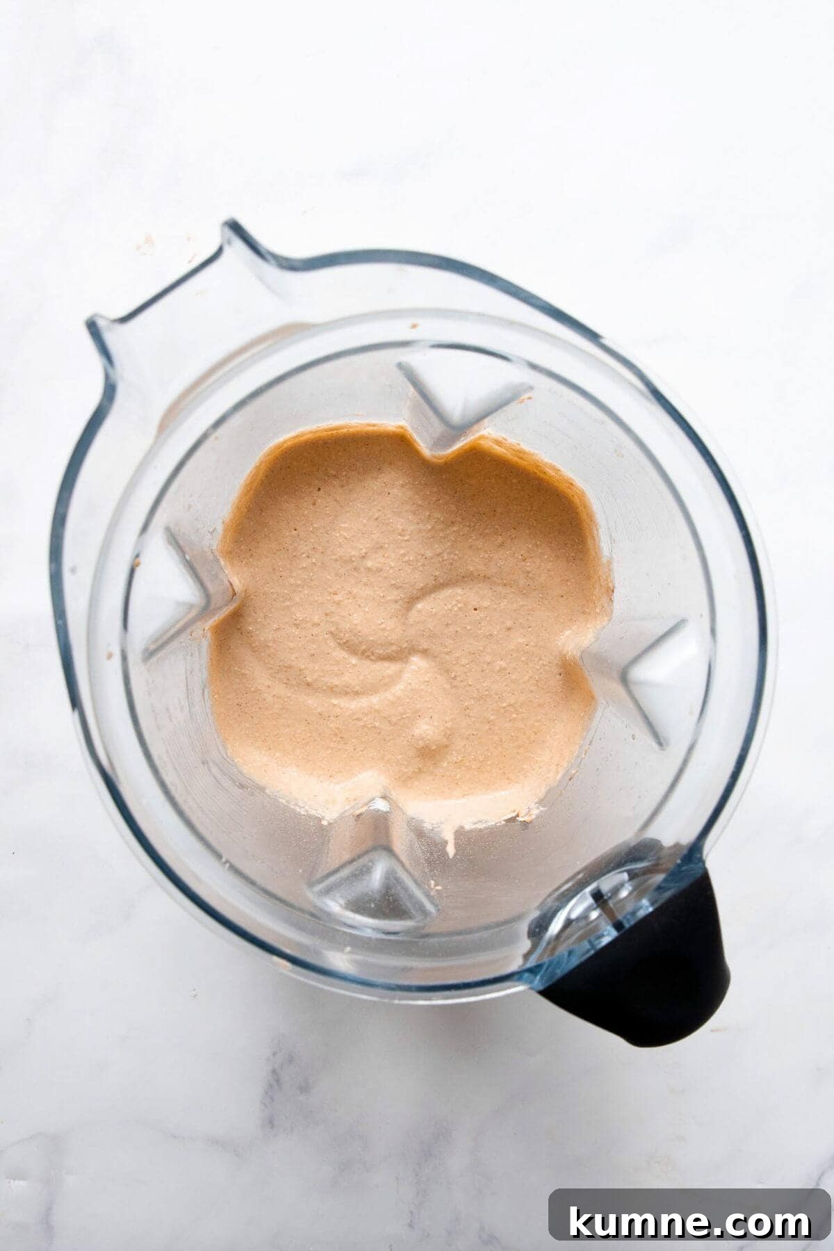 Smooth pumpkin protein pancake batter in a blender.