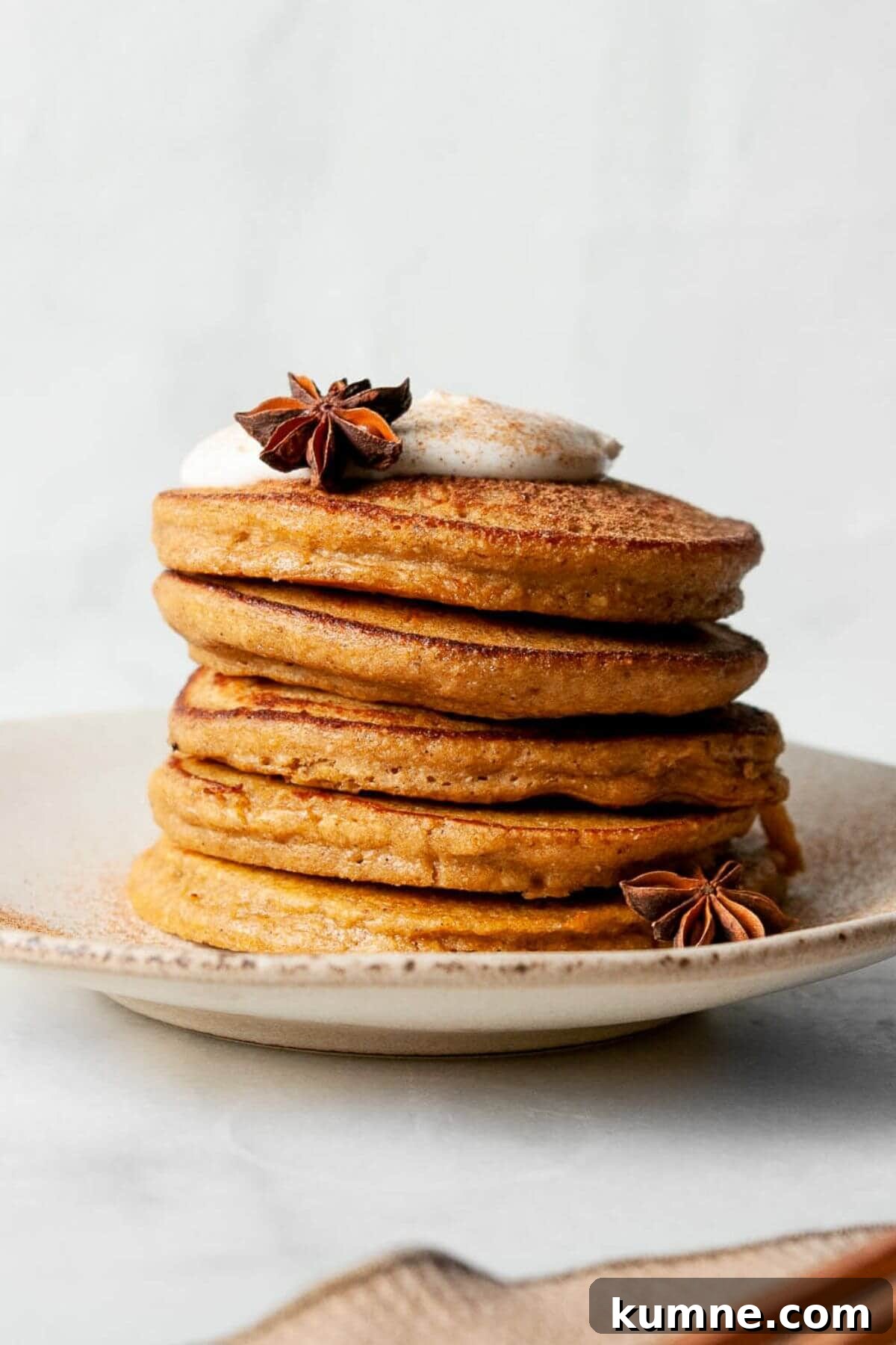 Healthy oatmeal protein pumpkin pancakes with crispy edges and super fluffy centers.