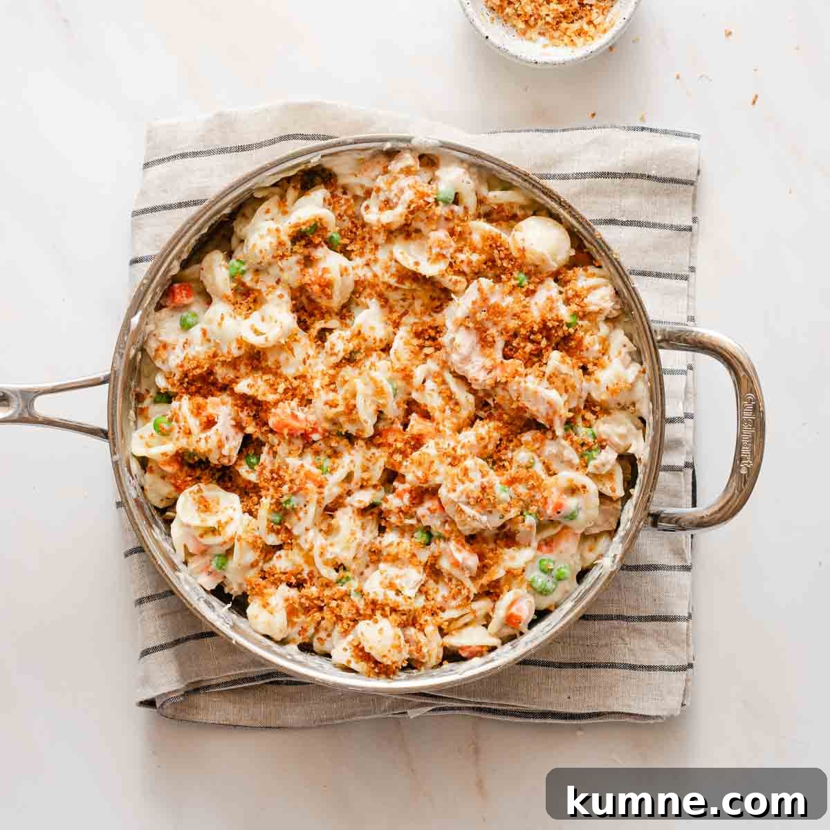 One-Pot Stovetop Tuna Casserole Recipe 11 tuna casserole in shallow pot with toasted breadcrumb topping.