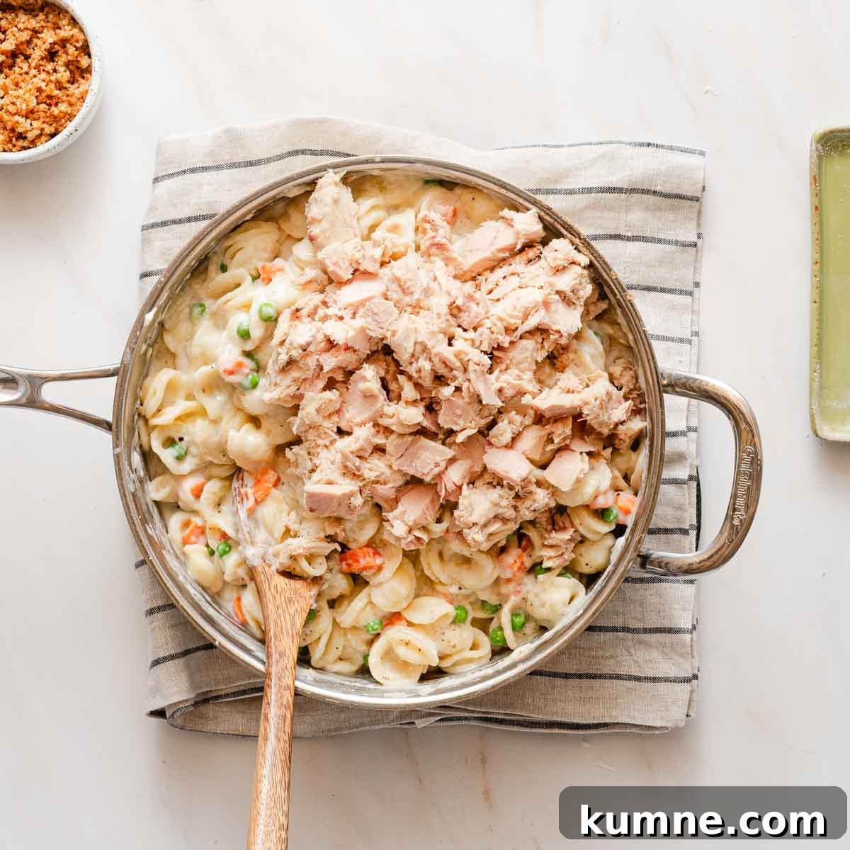 One-Pot Stovetop Tuna Casserole Recipe 9 tuna on top of casserole noodles in pot.