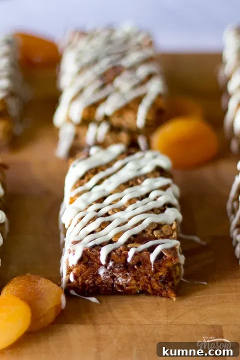 Chewy Apricot and White Chocolate Flapjack Recipe for Snacktime 6 Apricot and white chocolate flapjacks on a board with dried apricots