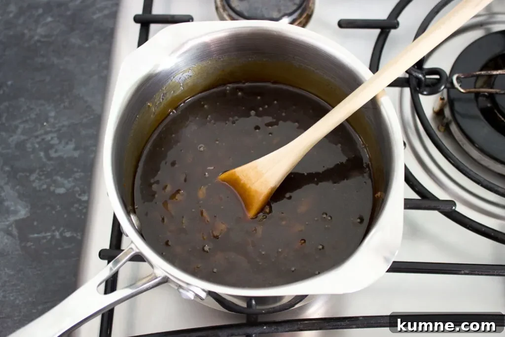 Chewy Apricot and White Chocolate Flapjack Recipe for Snacktime 8 Sticky treacle and apricot syrup in a saucepan